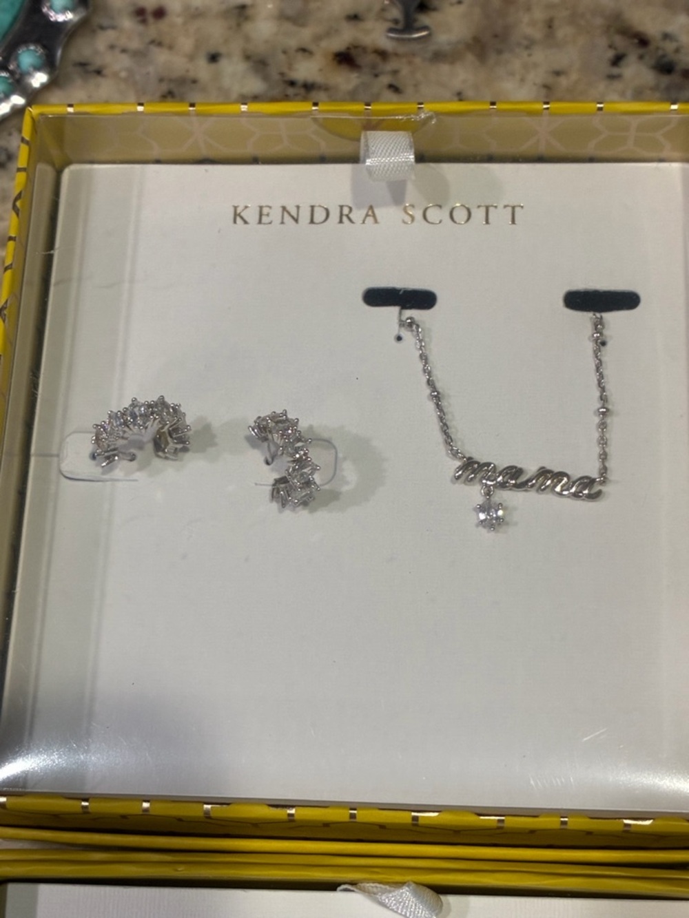 New in box Kendra Scott silver “Mama” necklace and Cailin Huggie earrings